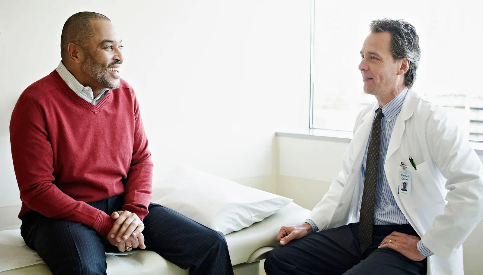 Physician reviewing findings with a patient during an in-office consultation