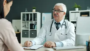 Physician reviewing findings with a patient during an in-office consultation